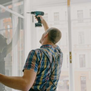 man fixing frames