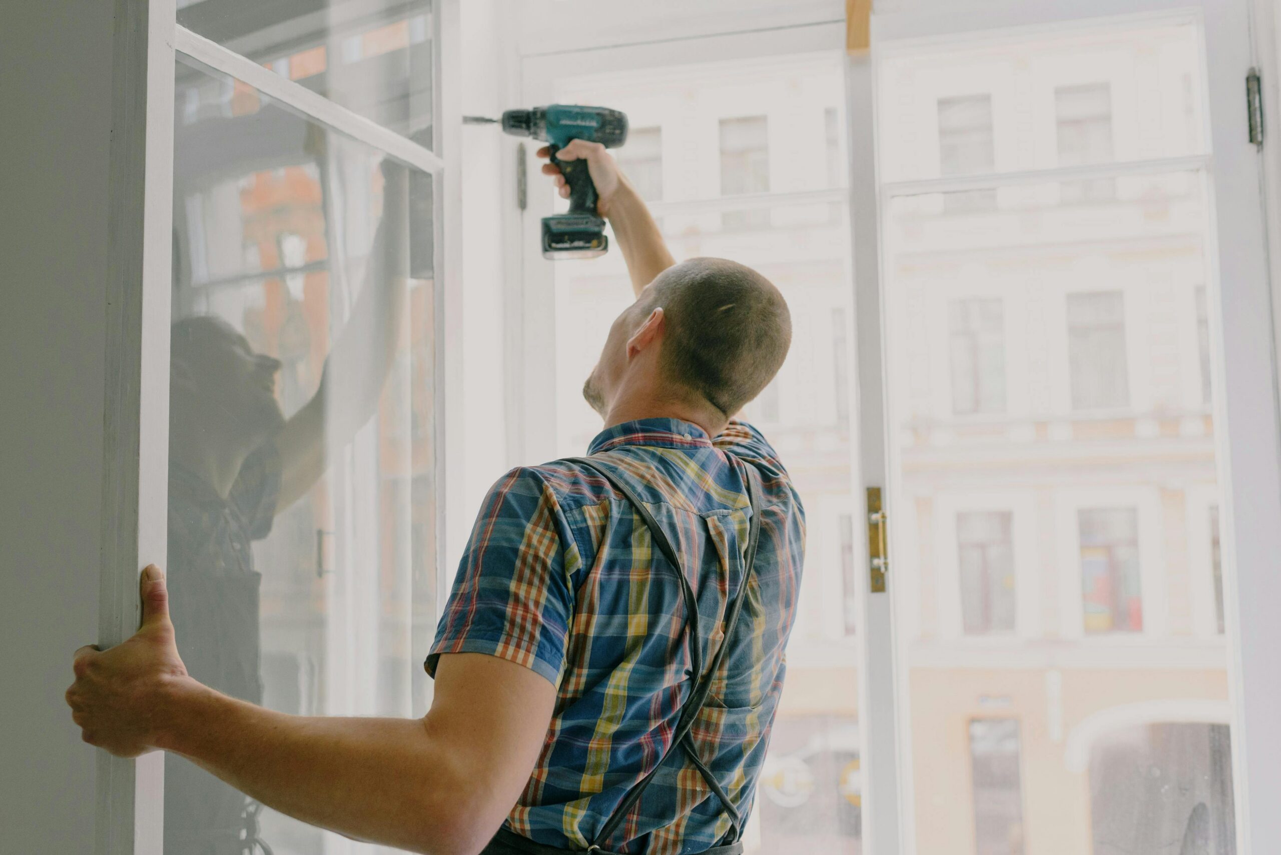 man fixing frames